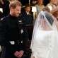 Britain's Prince Harry looks at his bride