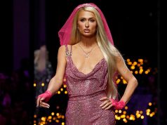 Paris Hilton presents a creation from the Versace Spring/Summer 2023 collection during Milan Fashion Week in Milan, Italy, September 23, 2022. REUTERS/Alessandro Garofalo