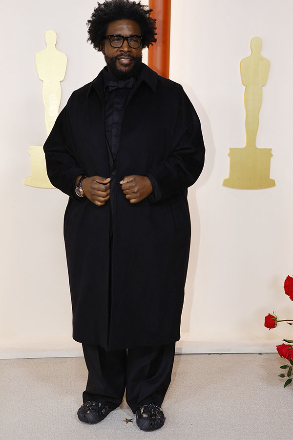 Questlove poses on the champagne-colored red carpet during the Oscars arrivals at the 95th Academy Awards in Hollywood, Los Angeles, California, U.S., March 12, 2023. REUTERS/Eric Gaillard