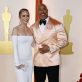 Emily Blunt and Dwayne Johnson pose on the champagne-colored red carpet during the Oscars arrivals at the 95th Academy Awards in Hollywood, Los Angeles, California, U.S., March 12, 2023. REUTERS/Eric Gaillard